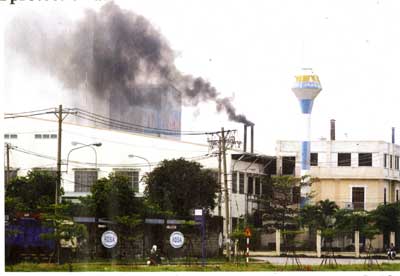 A factory in Tan Binh Industrial Park in HCMC emits black smoke. 